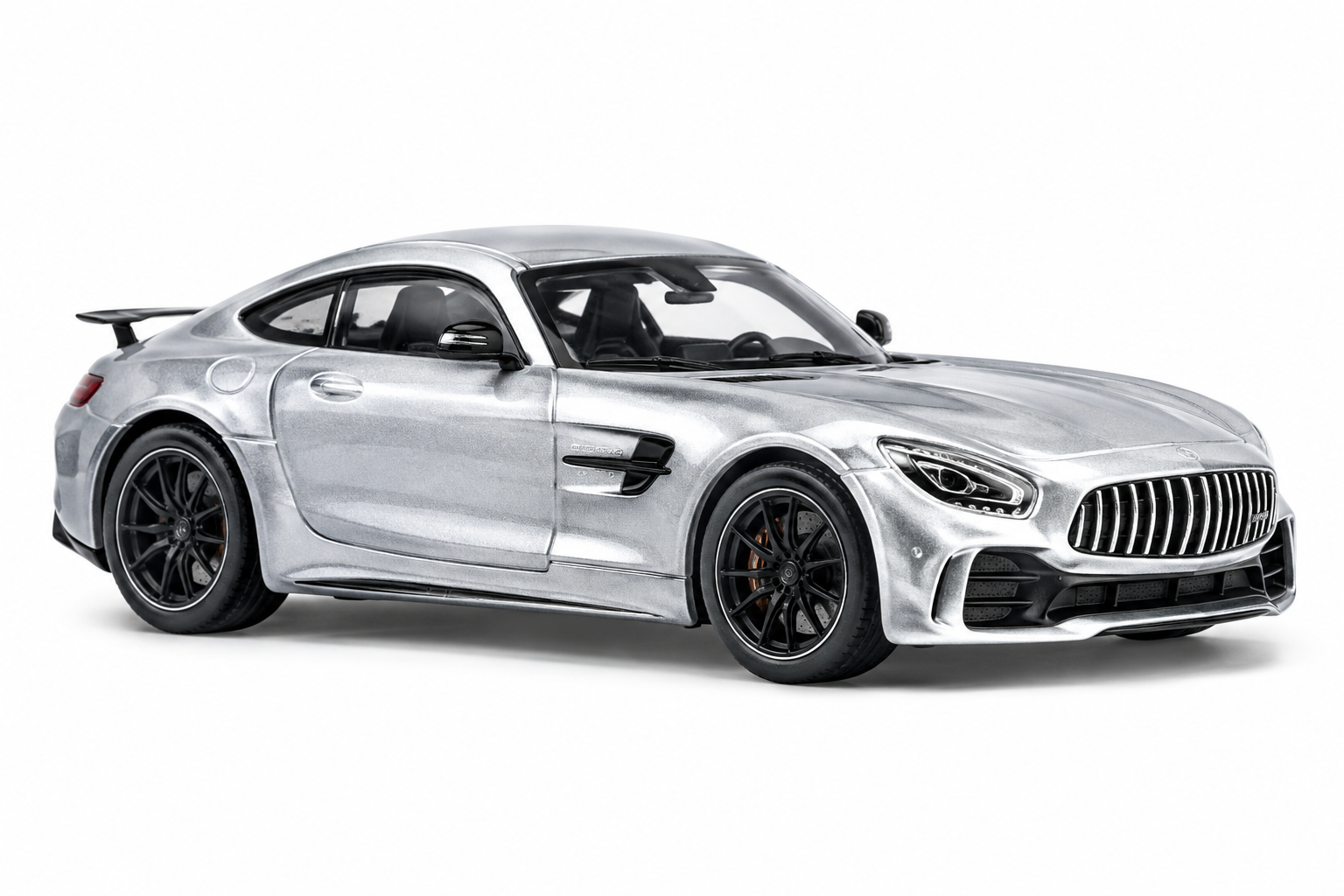 Silver grand tourer diecast car on white